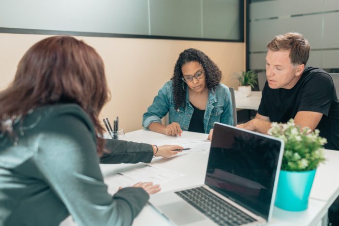 A team of employees work together on a project.